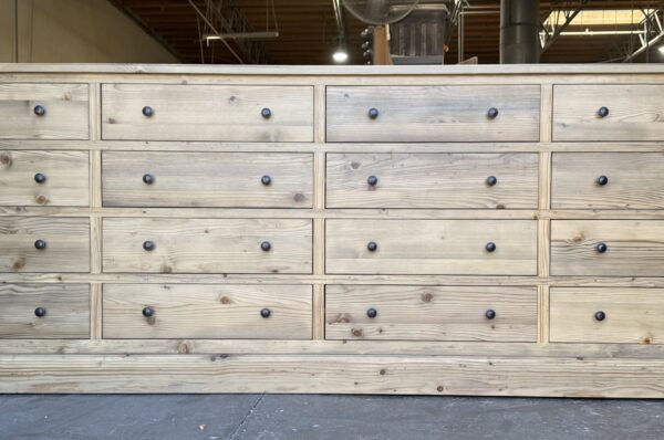 Custom Benjamin Dresser in Natural Finish with 16 drawers in four rows and four columns, by Vintage Mill Werks.