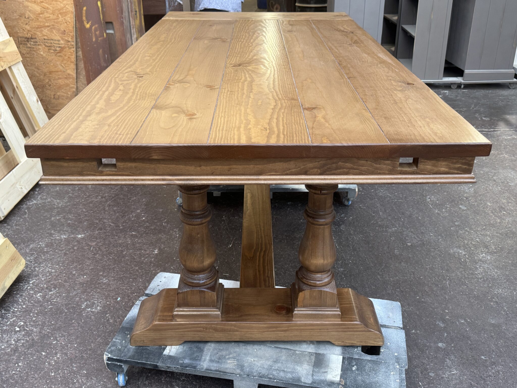 End of the Oxford table with two openings in the apron for extension support arms