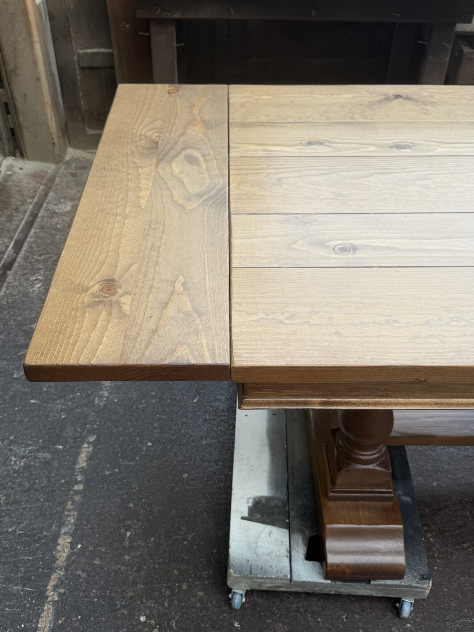 Close-up of an installed breadboard extension meeting the Oxford tabletop